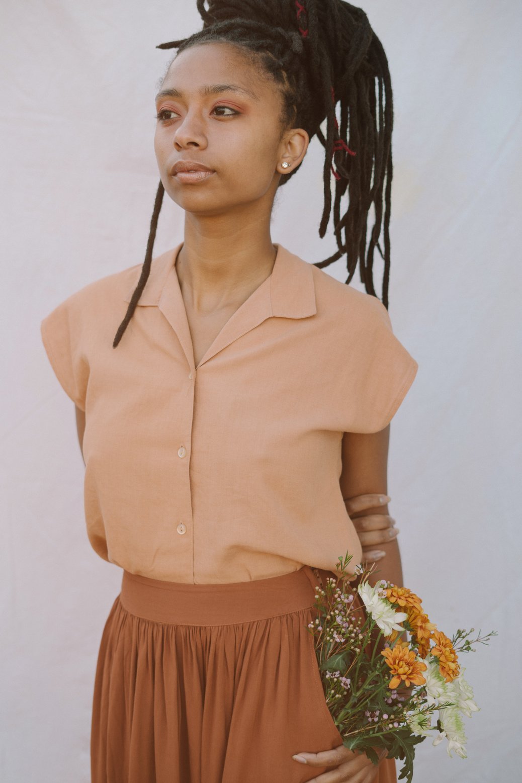 Woman with Flowers in Her Pocket 